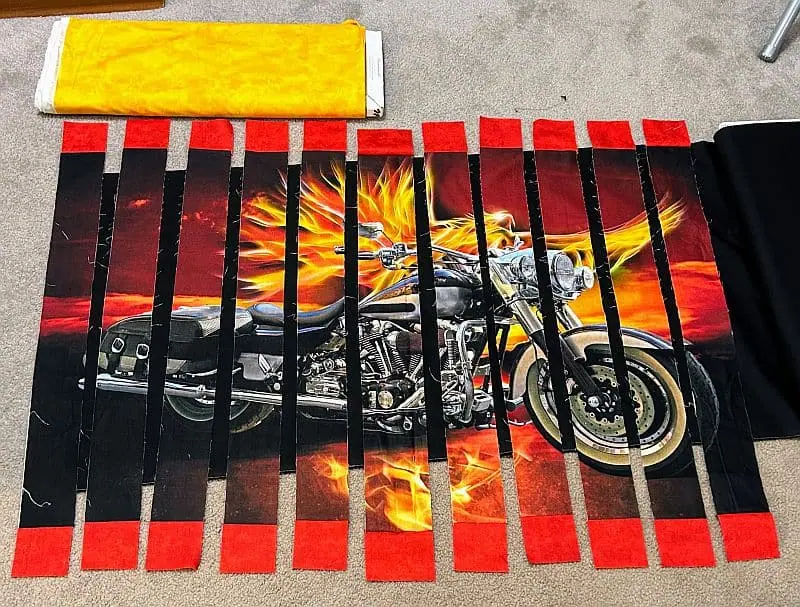 Auditioning fabrics for a fractured motorcycle quilt