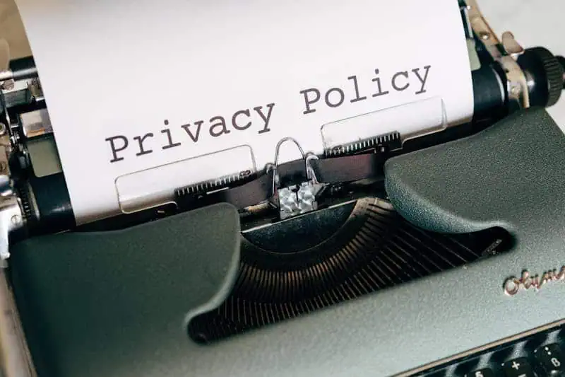 Type privacy policy document on a vintage typewriter for data privacy and security themes.
